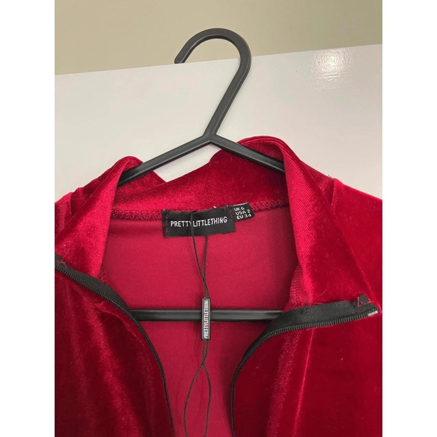 Striking red velvet jumpsuit from PrettyLittleThing, size UK 6.