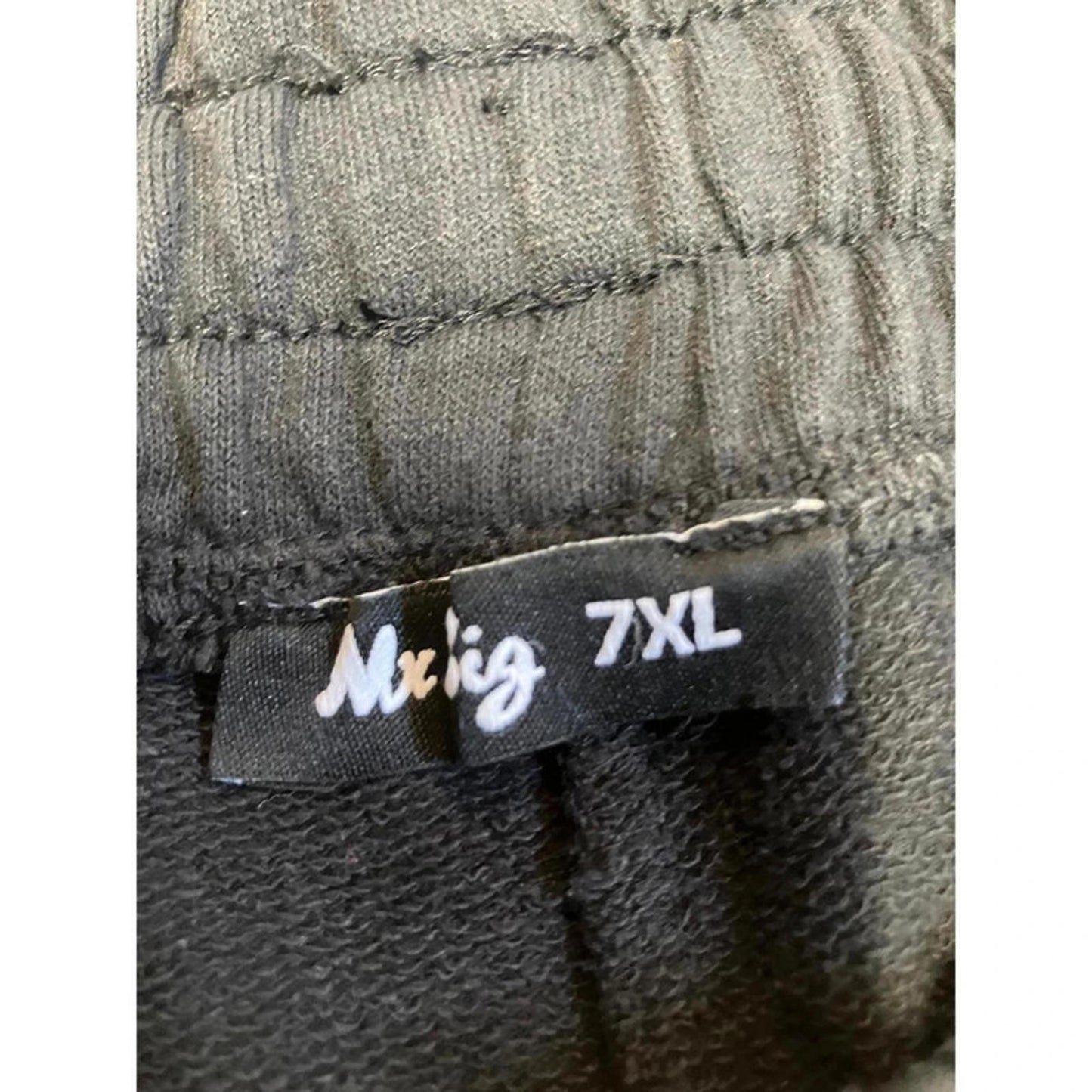 Black men’s casual shorts with drawstring elastic waistband and pockets.