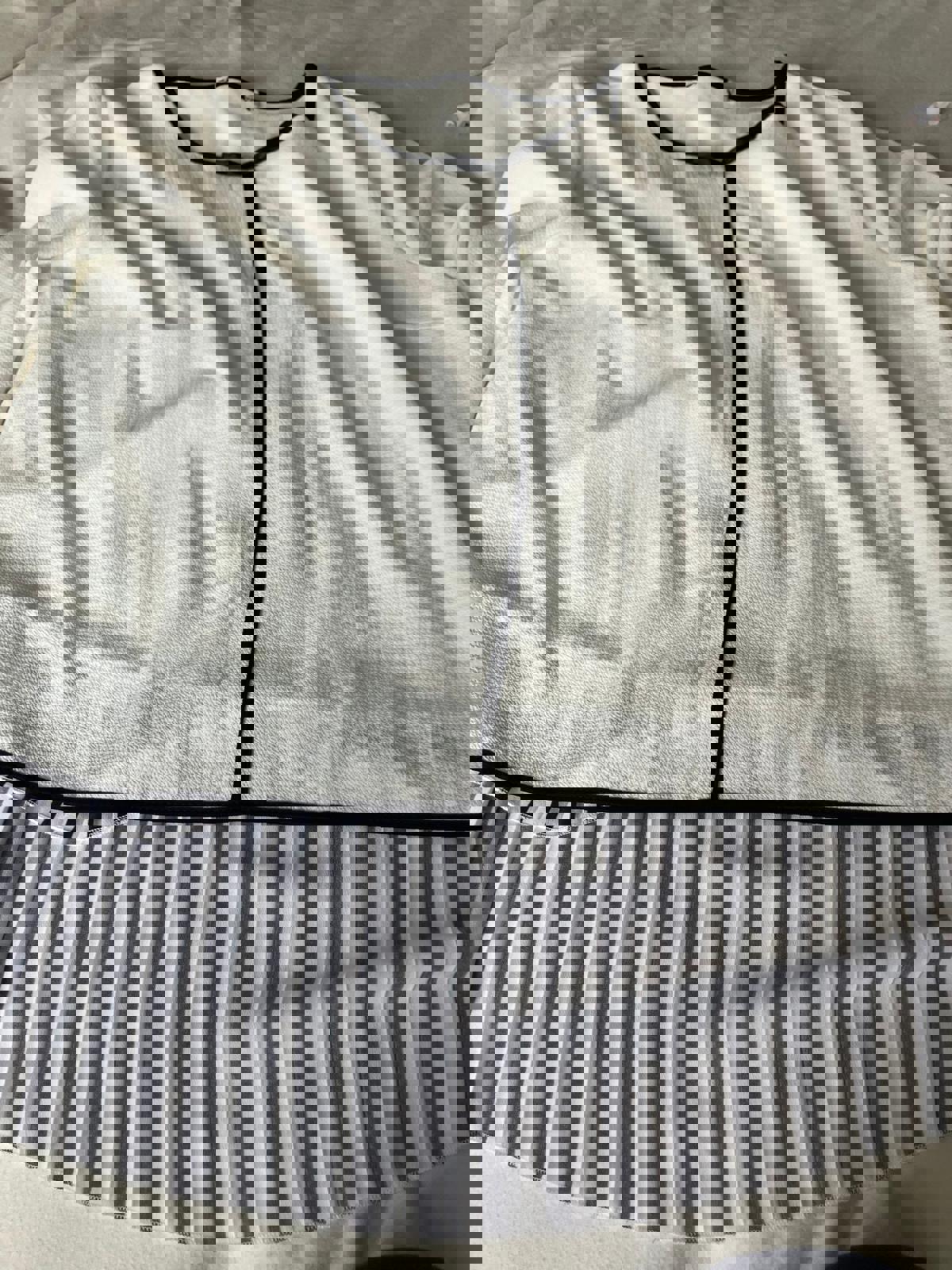 Lovely Women's White and Black Trim Blouse with Striped Hem