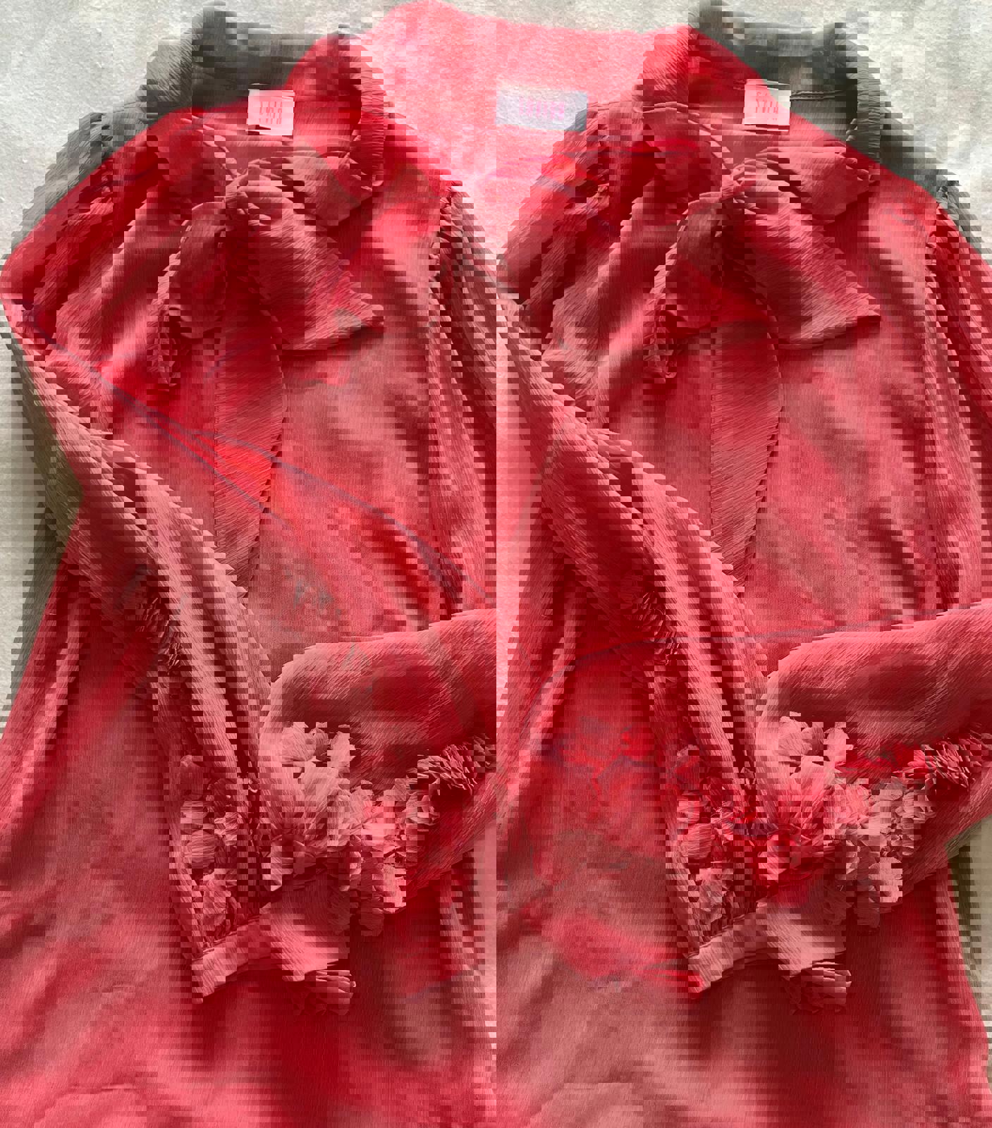 Charming Coral Pink Bow Tie Blouse with Floral Sleeve Detail