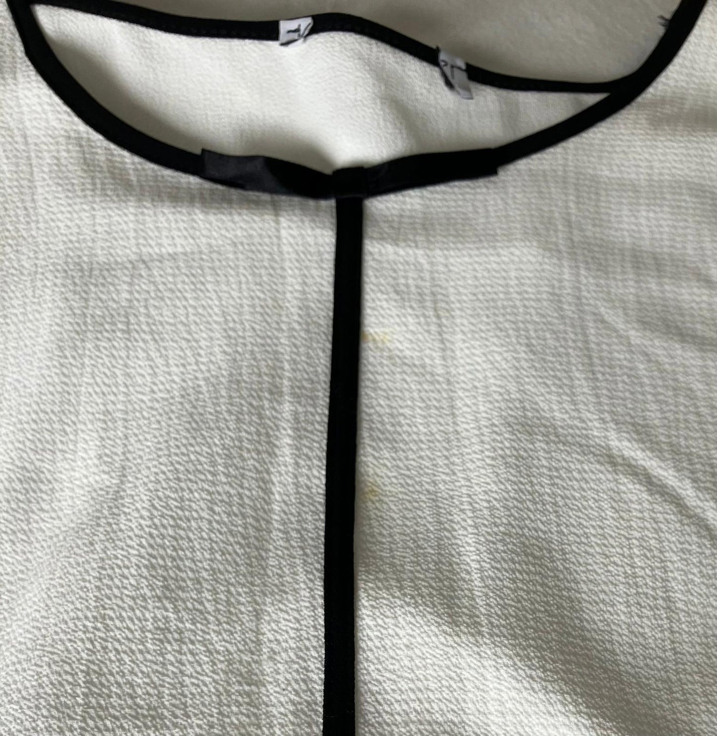 Lovely Women's White and Black Trim Blouse with Striped Hem