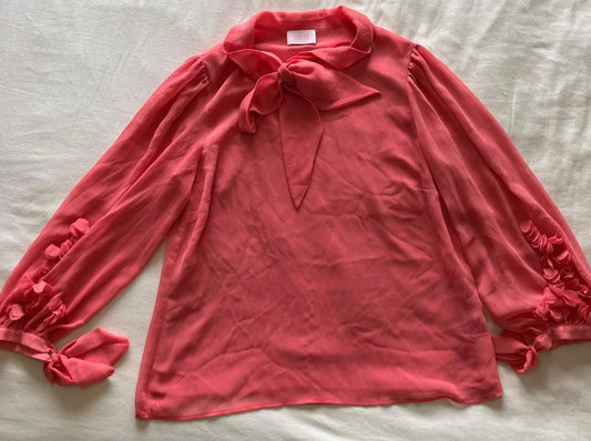 Charming Coral Pink Bow Tie Blouse with Floral Sleeve Detail